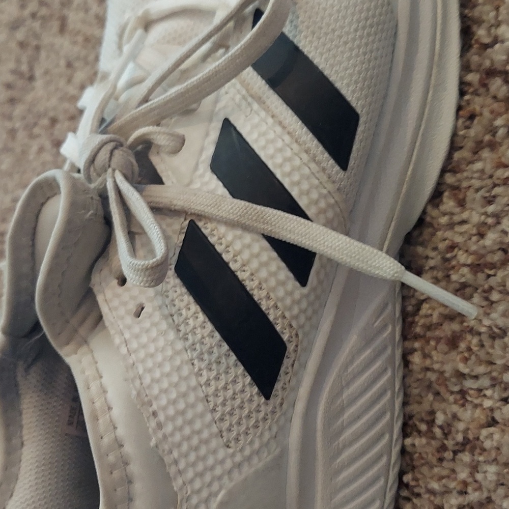 Women's 8.5 Adidas tennis shoes. White with black stripes.